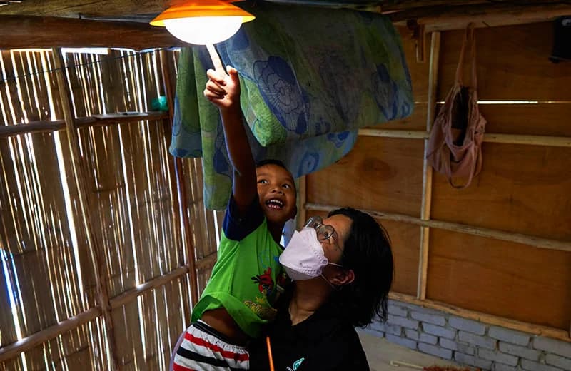 Child with solar lamp