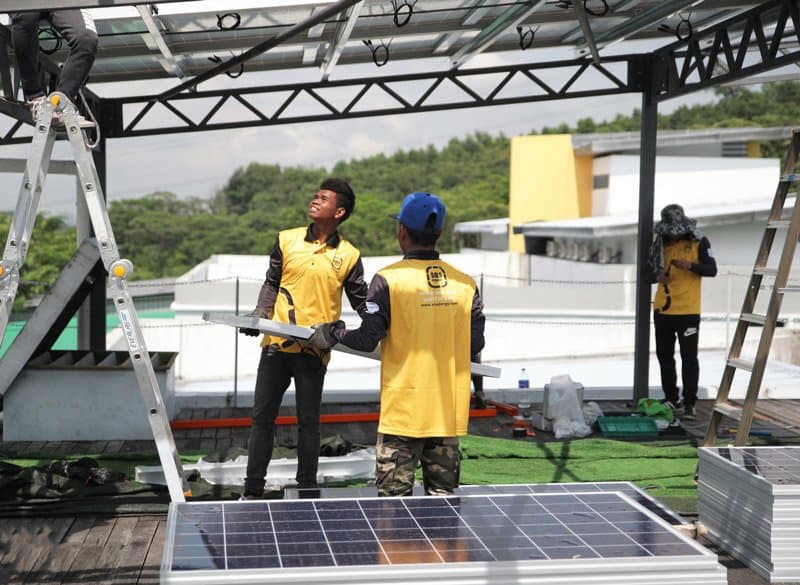 SOLS Energy installers fitting commercial solar panels